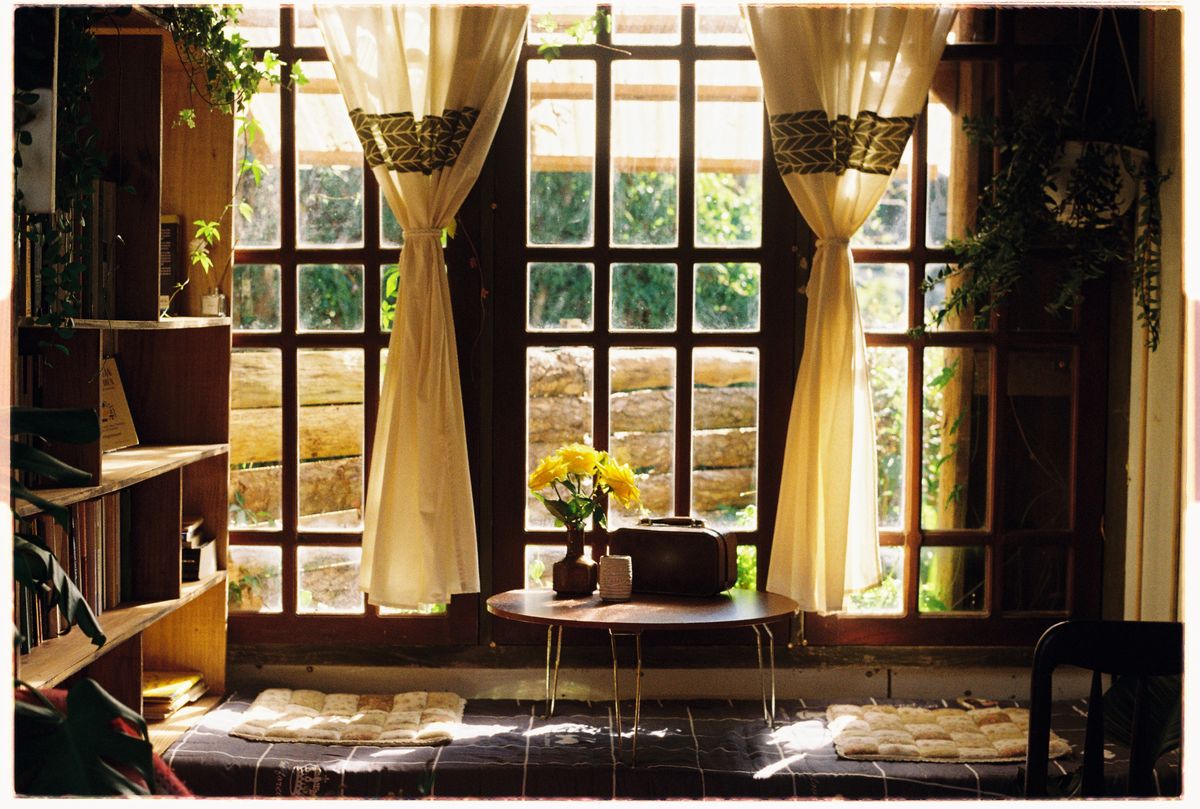 Warm sunlight through a wall of windows